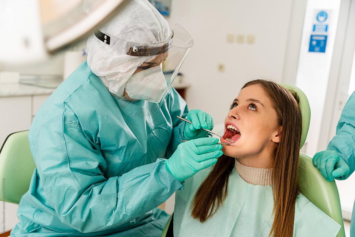 Dentist  working on a patient at the dental clinic