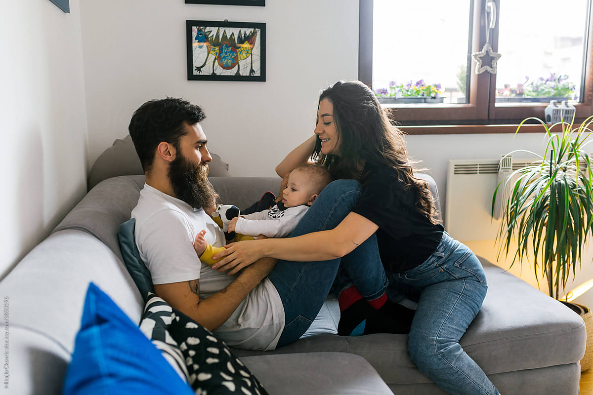 Young parents with baby boy at home