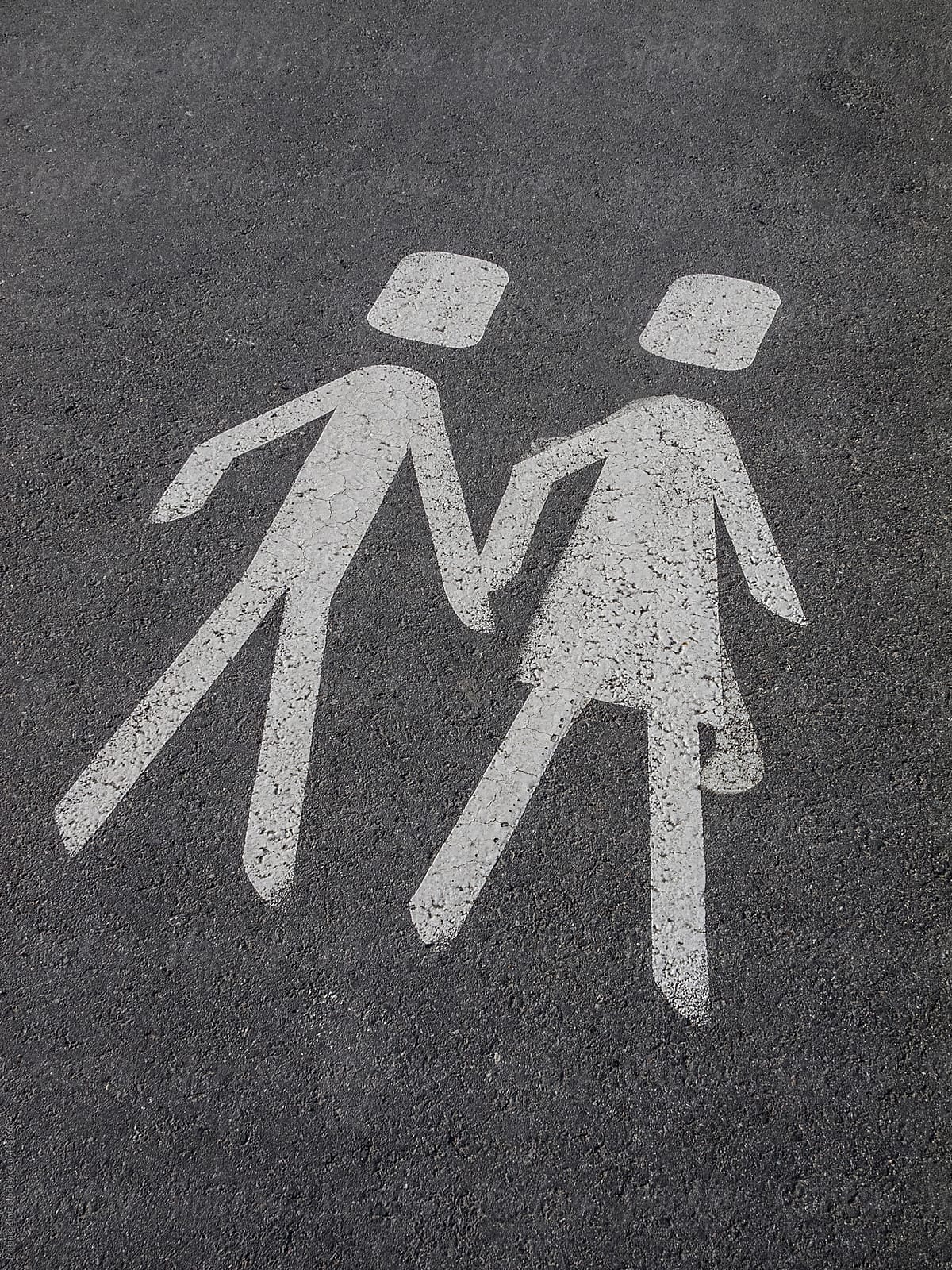 pedestrian sign on pavement