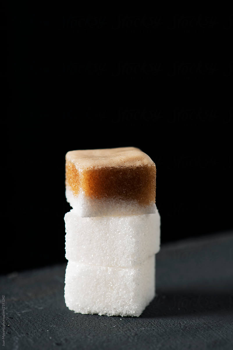 white sugar cubes with coffee