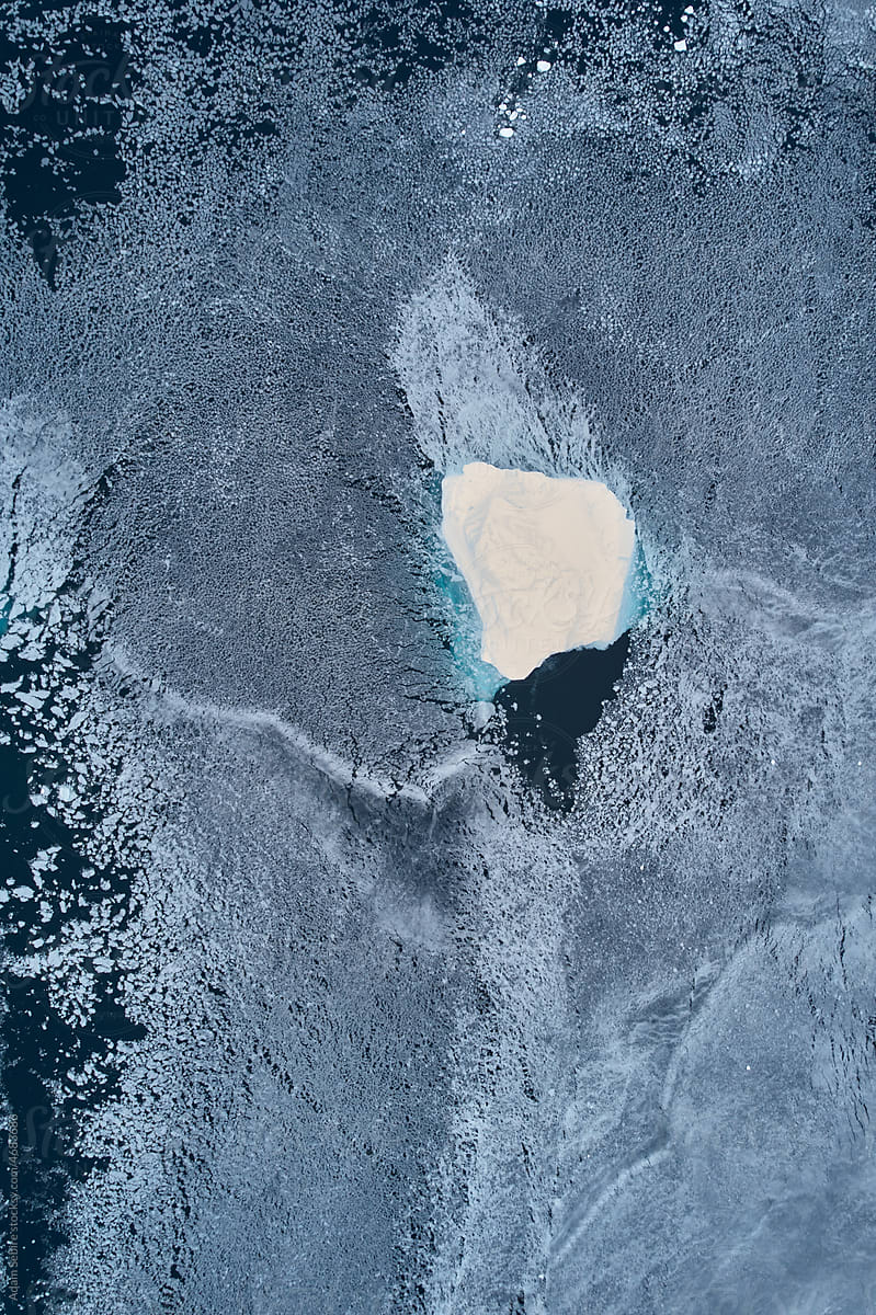 Greenland Arctic winter sea ice floe and iceberg, aerial abstract view