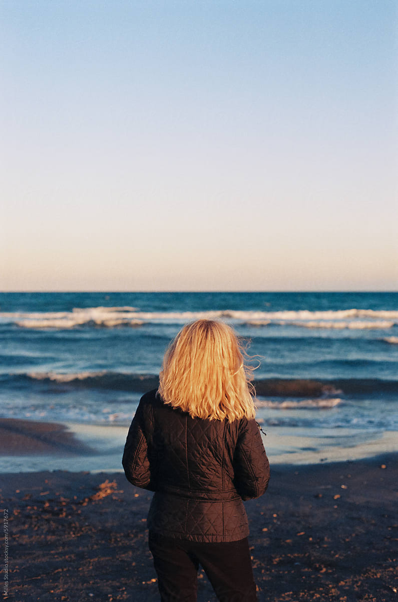 Woman watching sea waves