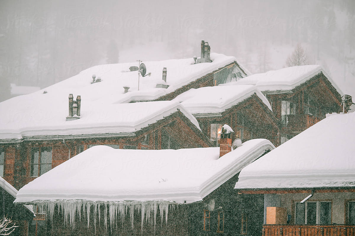 View on snow covered roofs in a small alpine village