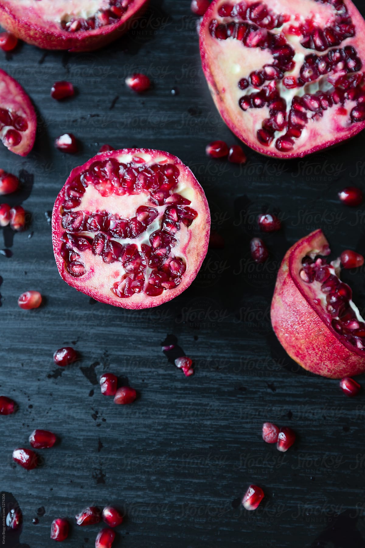 Close up of sliced pomegranate and seeds