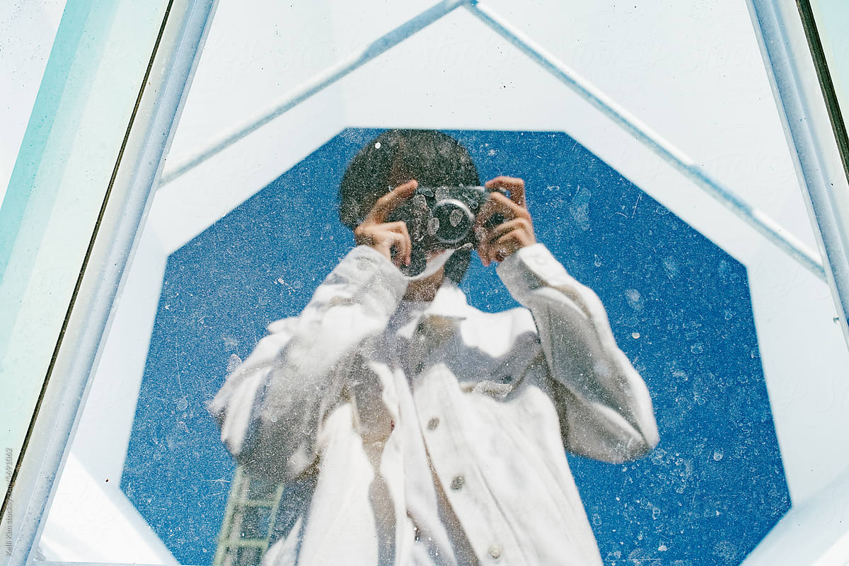 "Teen Reflection Selfie" by Stocksy Contributor "Kelli Kim"