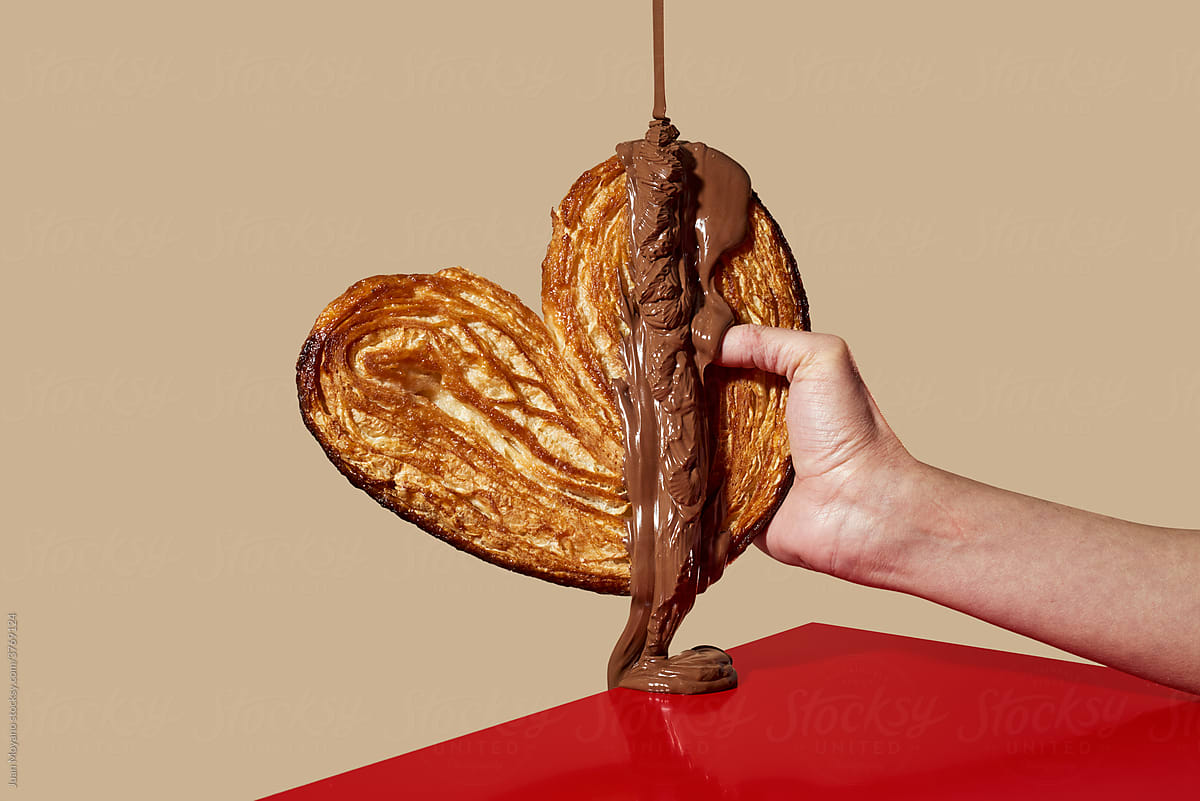 chocolate paste falls on a puff pastry heart