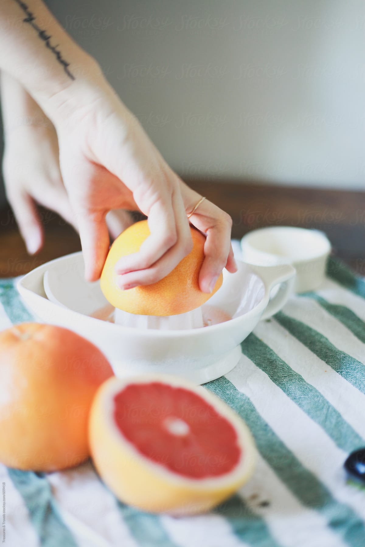 Hand juicing a grapefruit
