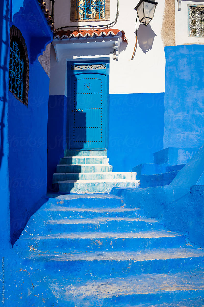 The entrance to a house colored in blue