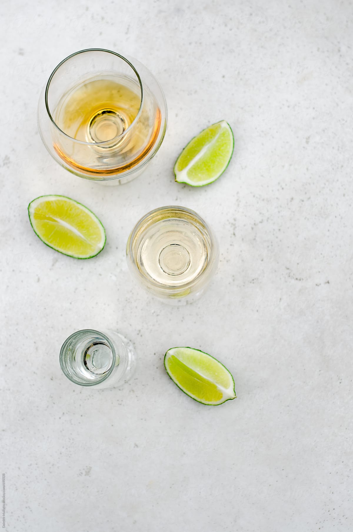 glasses of tequila and limes, from above