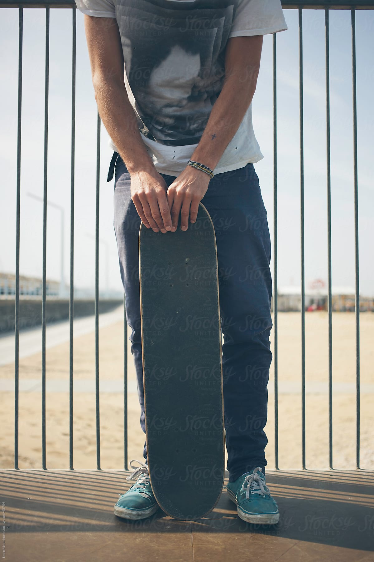 Skater holding his skateboard