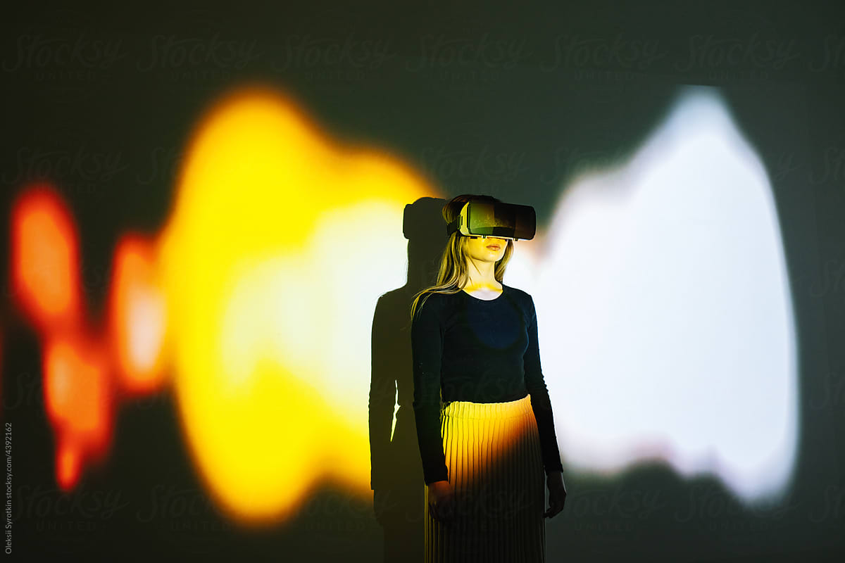 Female model in VR equipment in studio