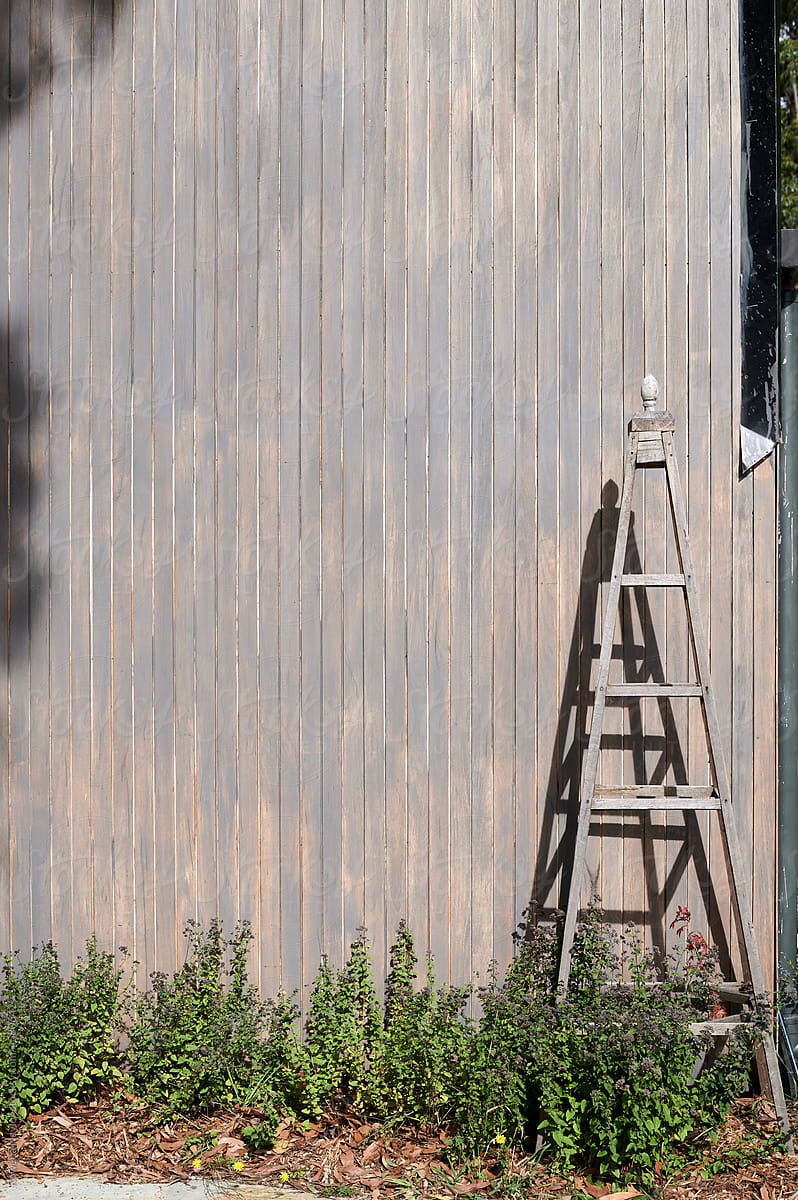 Timber trestle against large barn style property