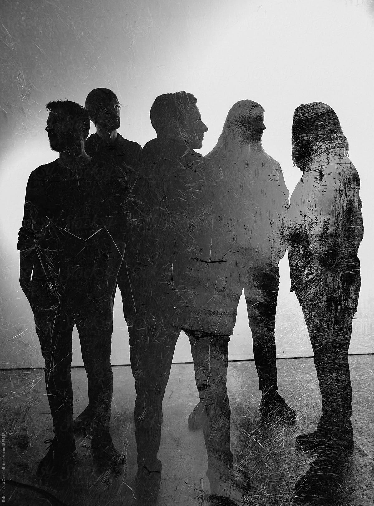 Double exposure of five member band on seamless background