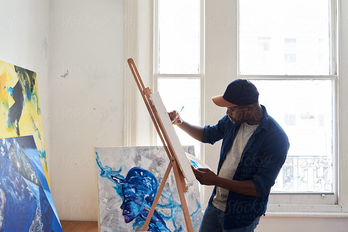 An artist painting strokes on canvas