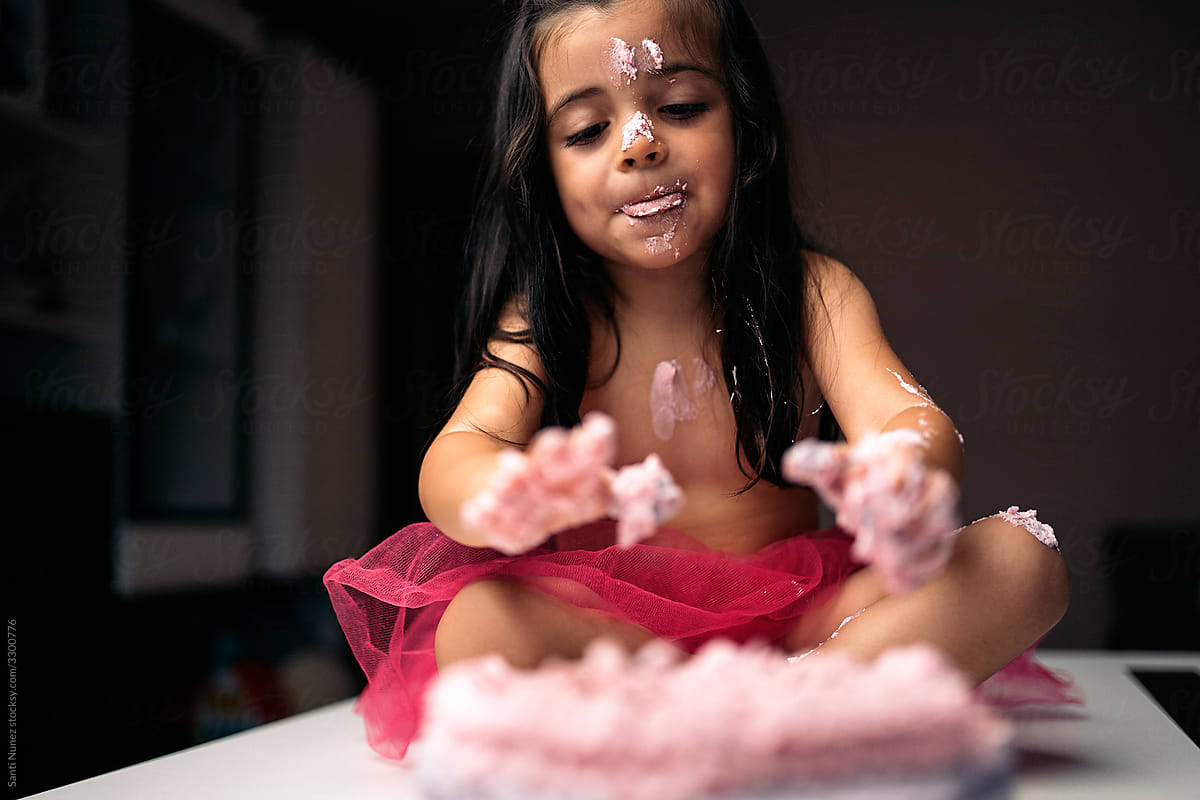 Adorable Little Girl Eating Cake