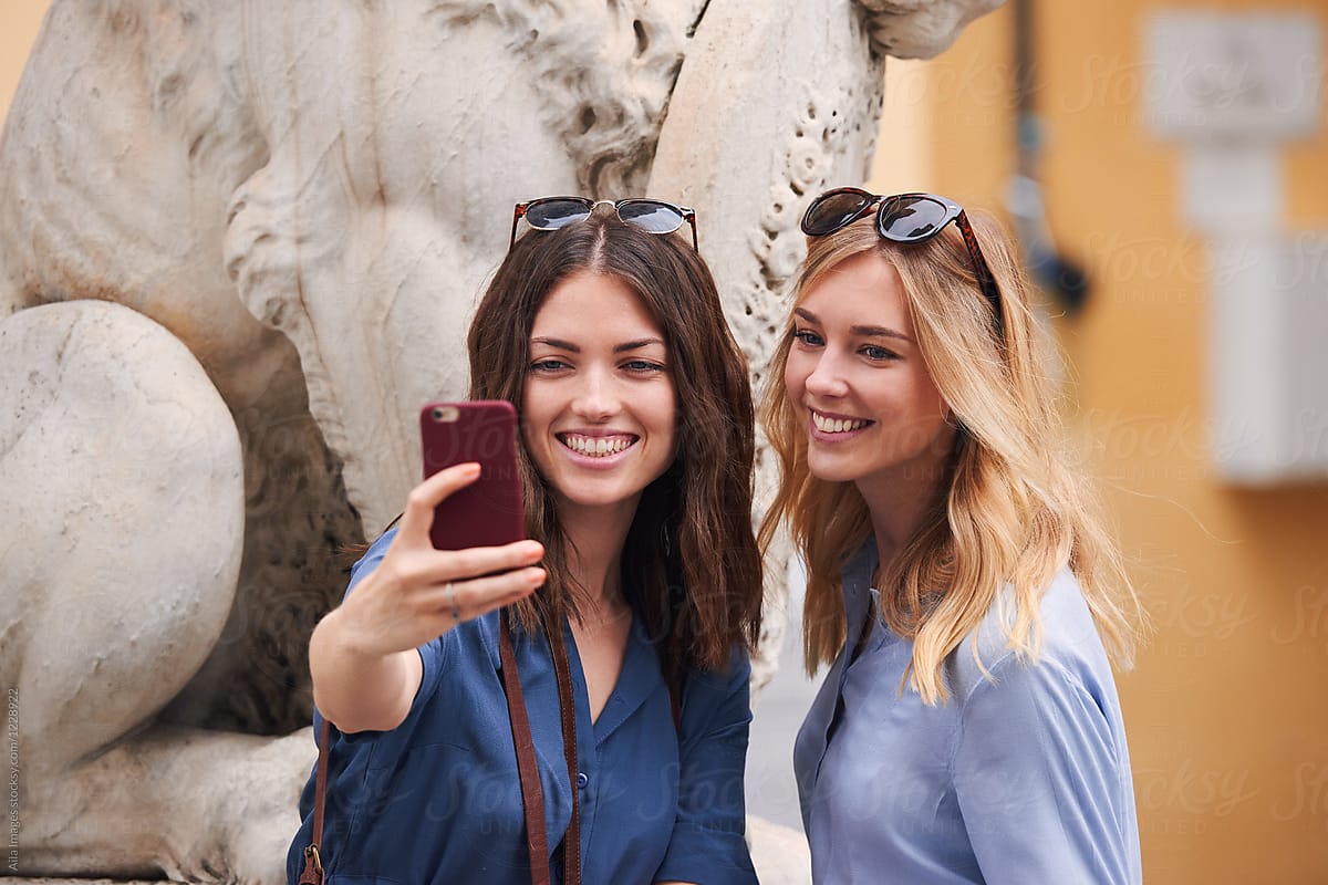 Beautiful Girl Friends Travelling Taking Selfies With Camera Pho By 