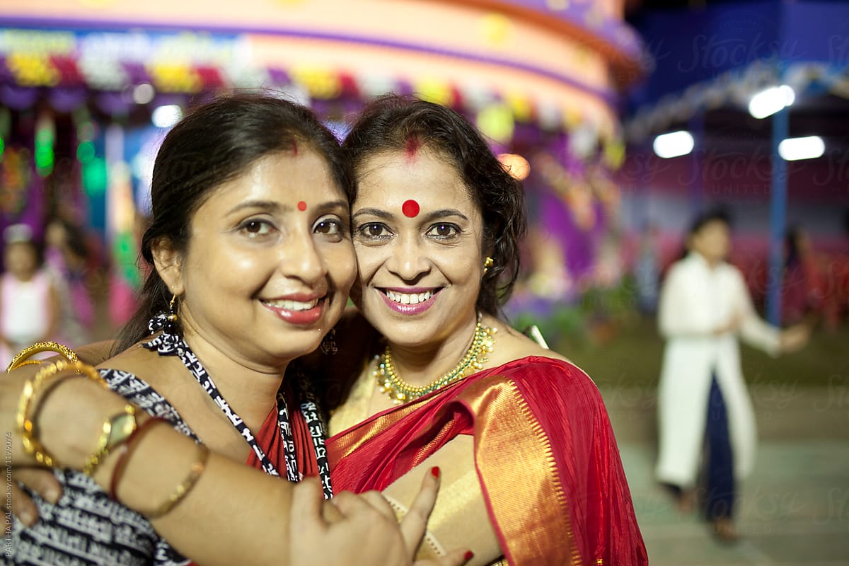Cheerful Indian women laughing and looking at camera