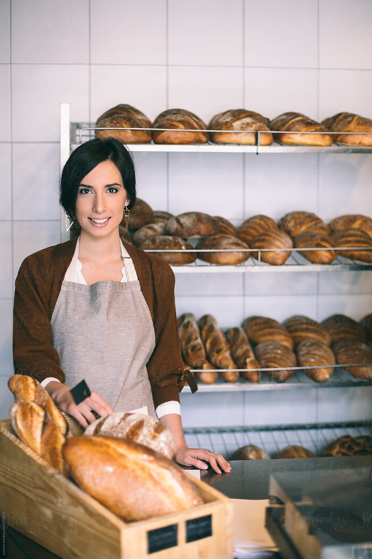 Smiling Saleswoman Selling Bread