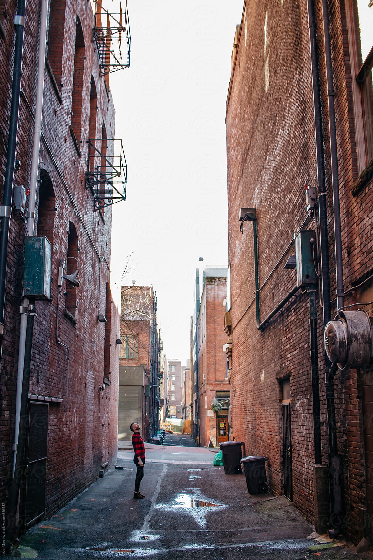 Young man exploring urban area of city scape