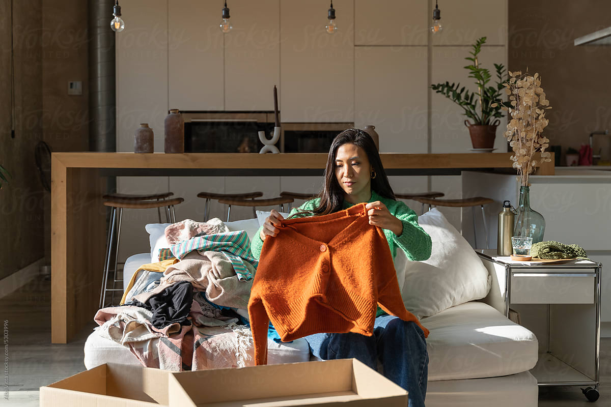 Woman Folding Laundry at Home