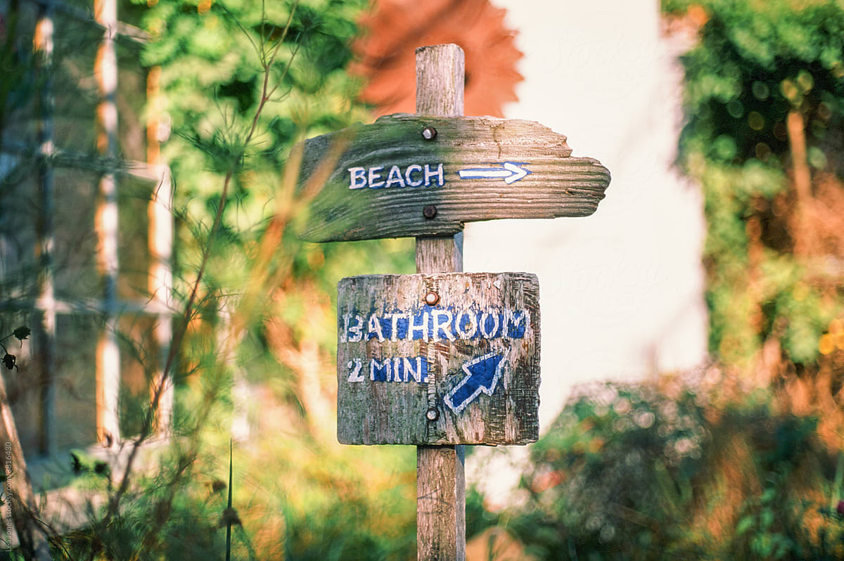 beach and bathroom sign