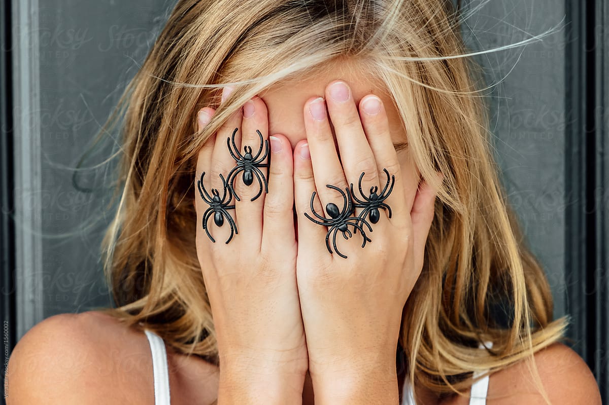 Girl Posing With Fake Spiders By Stocksy Contributor Vera Lair