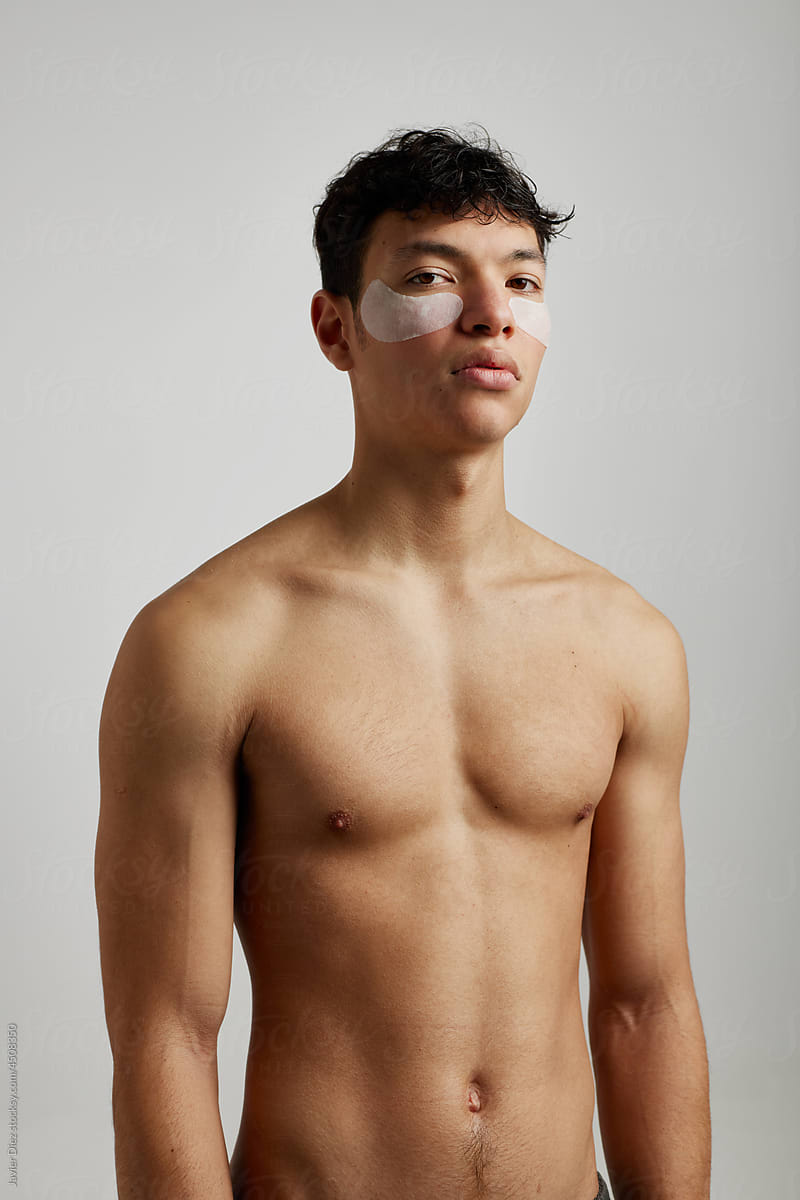 Shirtless man with eye patches