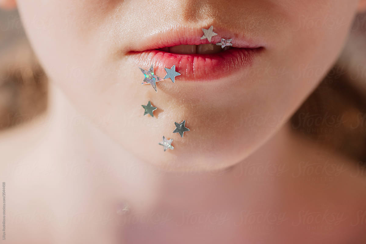 Crop photo of lips with silver stars make up