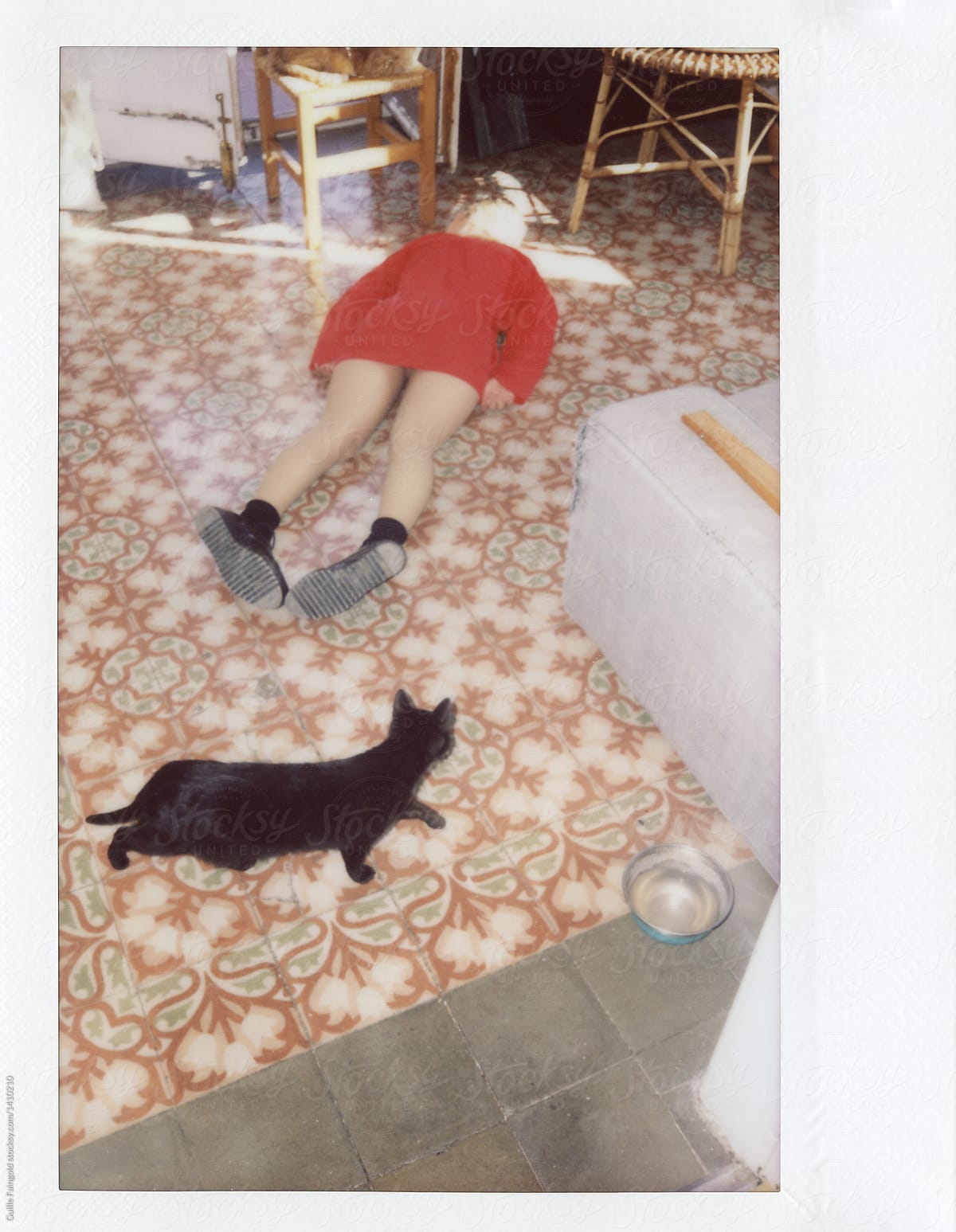 Lo-fi polaroid of Black cat pet and woman lying on floor