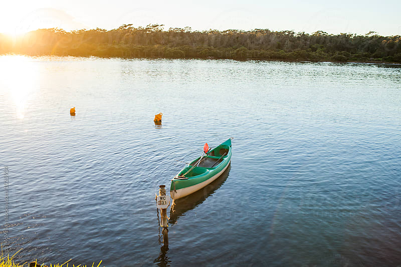 A canoe is tied up in a river