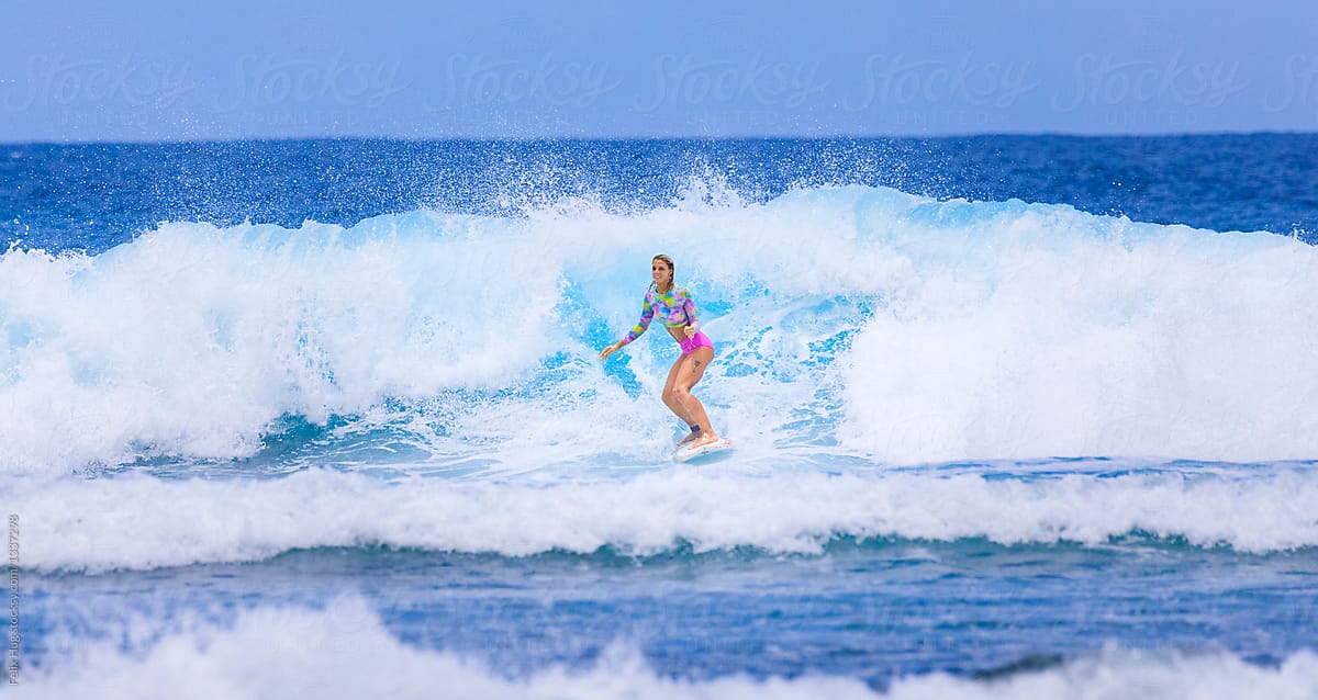 Female surfer in the waves