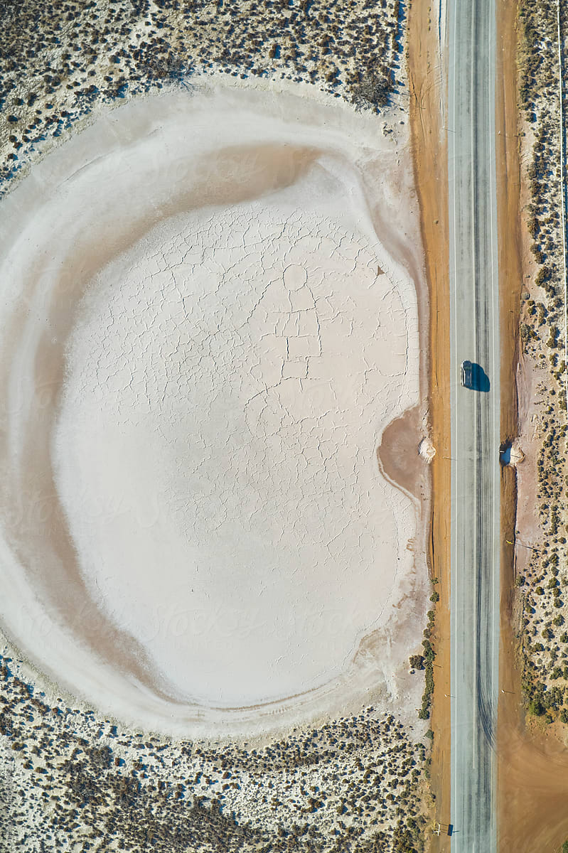 Driving by salt lake aerial