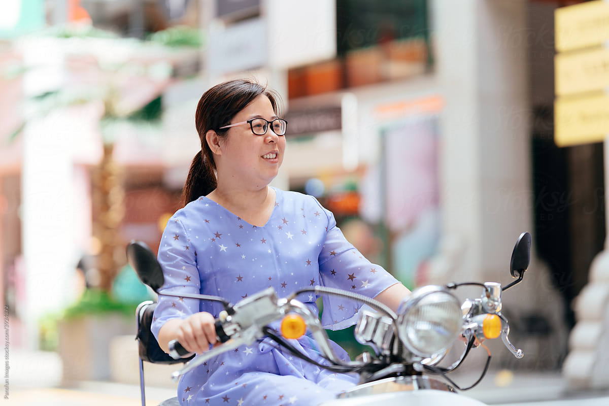 real Asian women riding a motorcycle