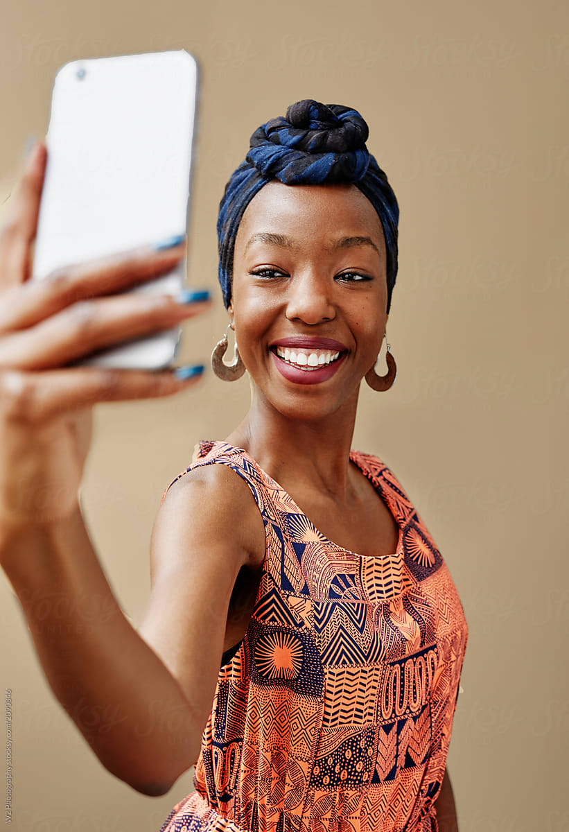 Young African woman taking a selfie.
