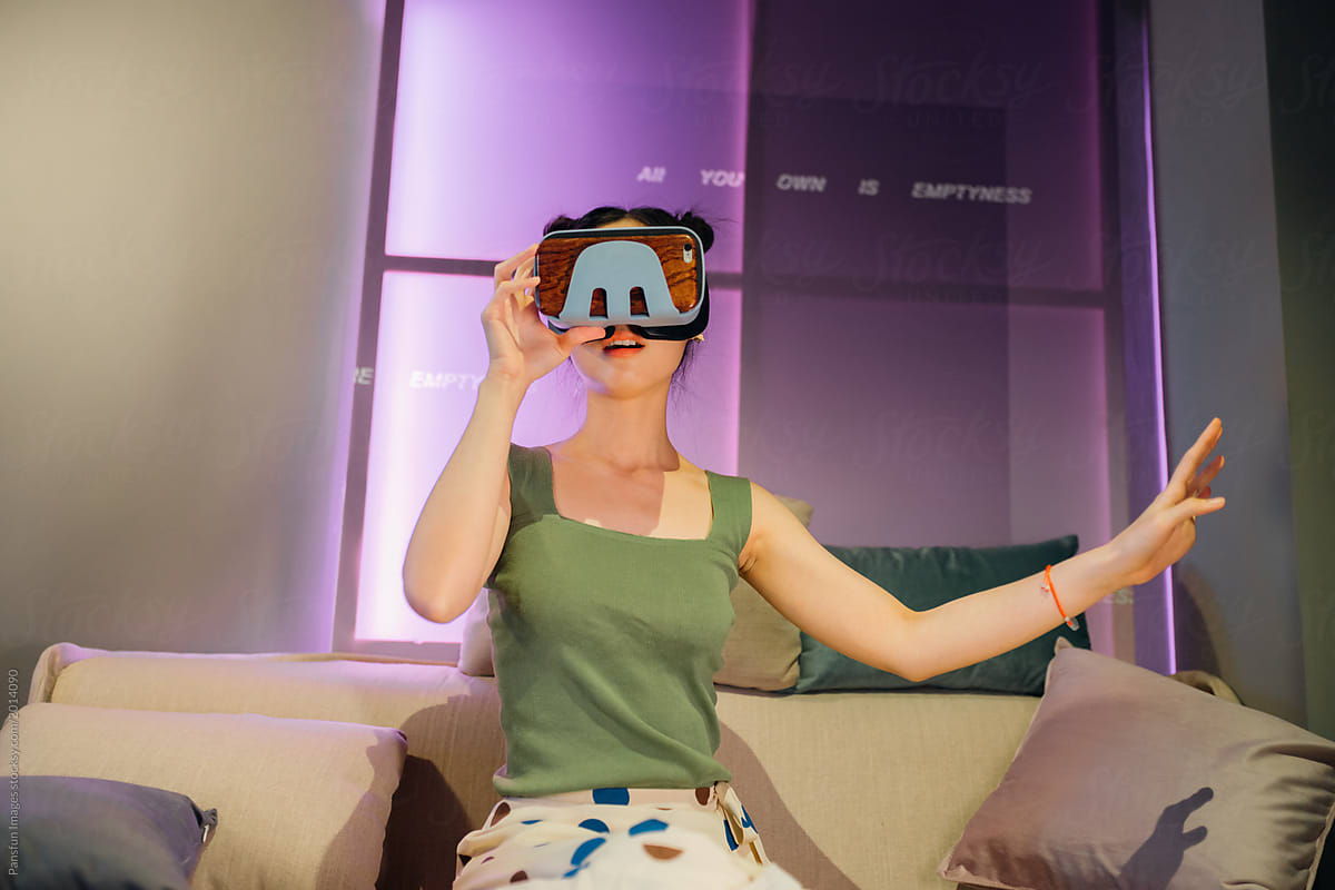 Asian Woman wearing virtual reality headset