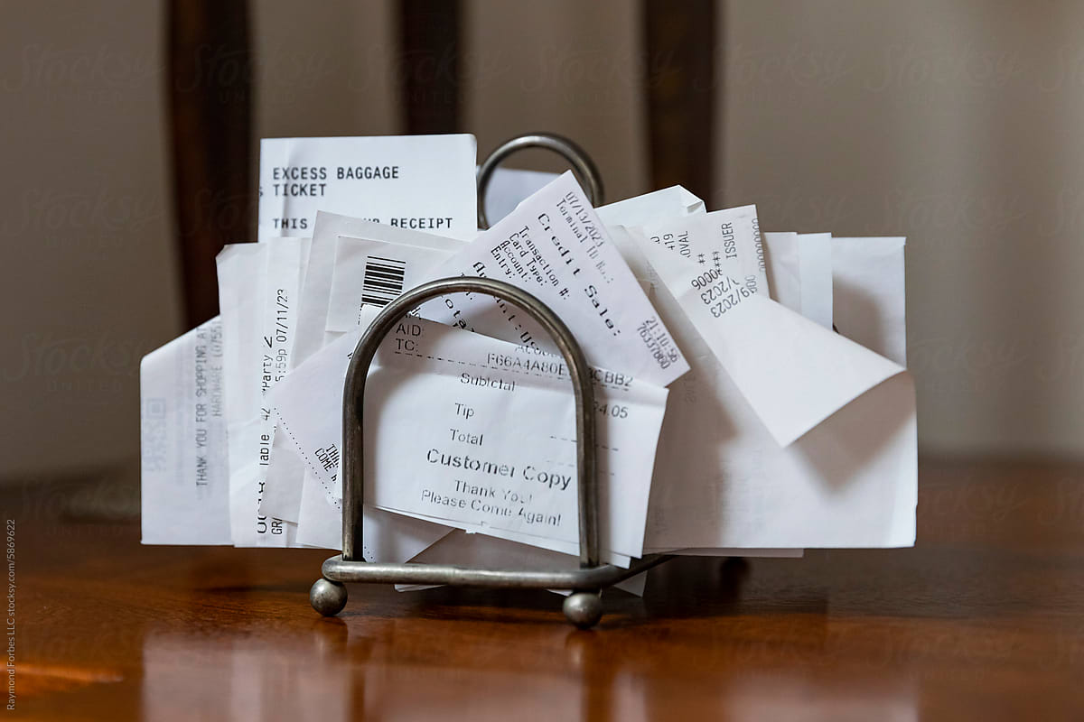 Organized Receipts in paper holder rack with calculator