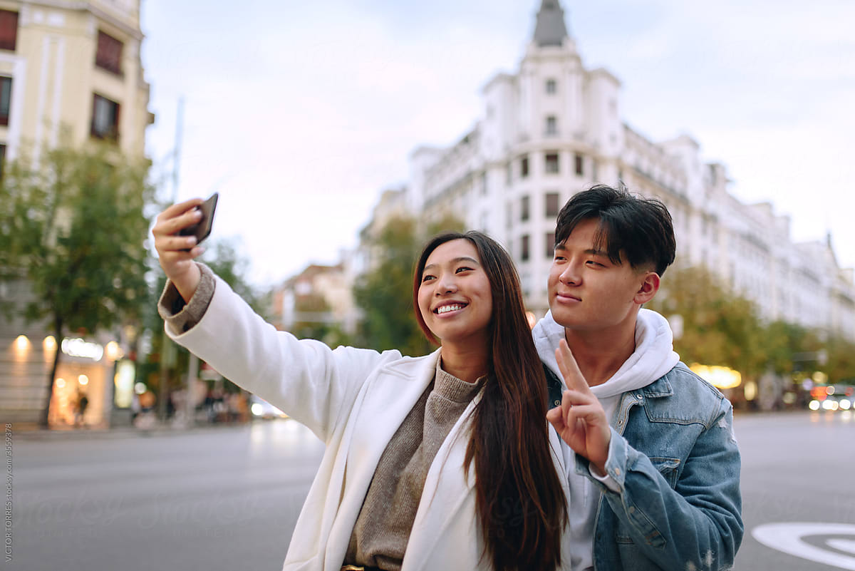 Chinese young couple taking a selfie