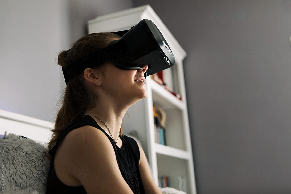 Teenager: Girl Using VR Headset In Bedroom