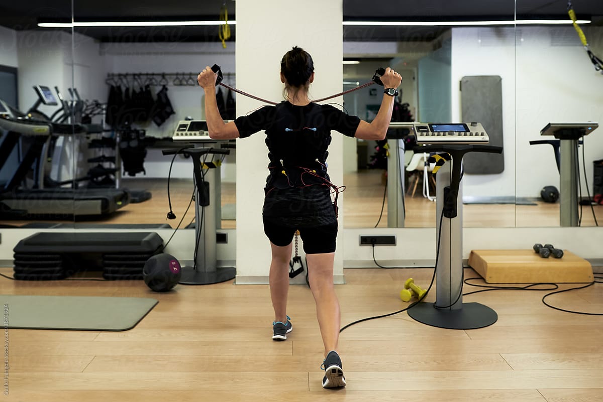 Woman working out in stimulating electrodes