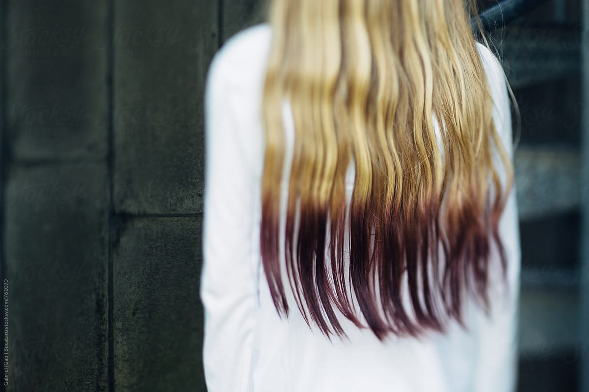 Purple dyed hair of a young blonde girl
