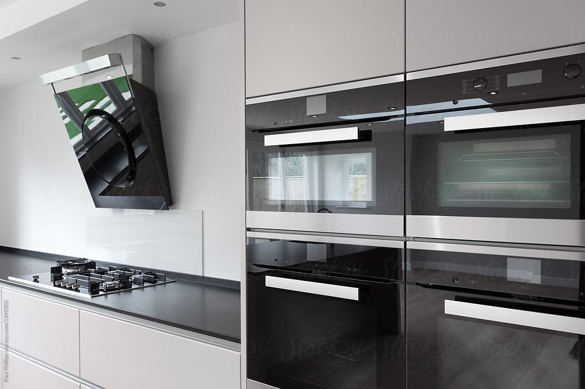 Modern kitchen units with integrated appliances.
