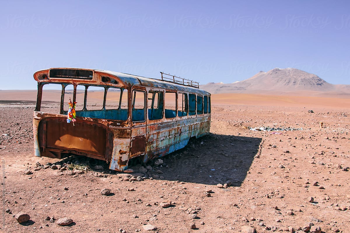 Rusty broken and abandoned bus on desert, Bolivia