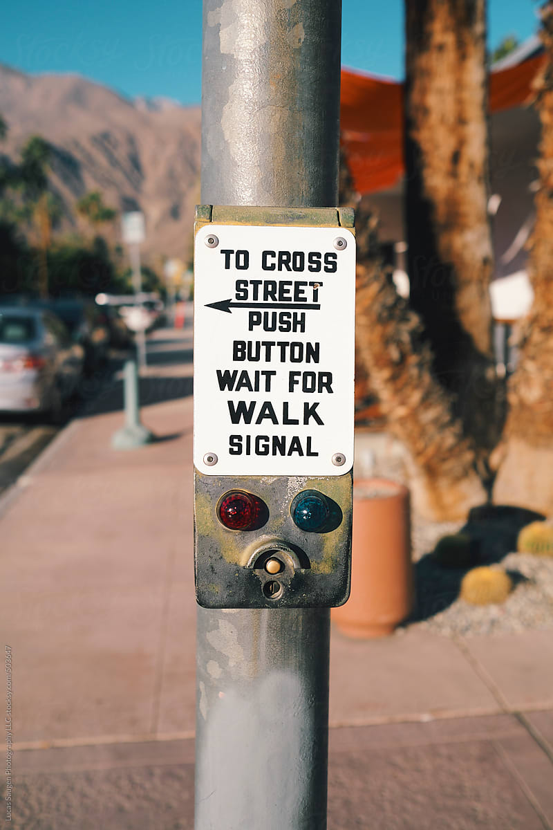 An old and odd crosswalk signal push button found in Palm Springs, California.