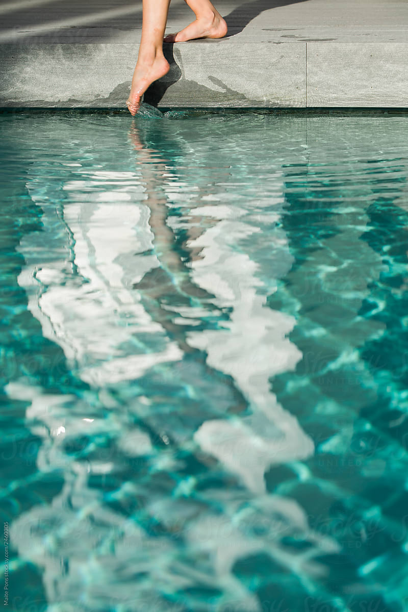 Girl Dipping Foot in Pool