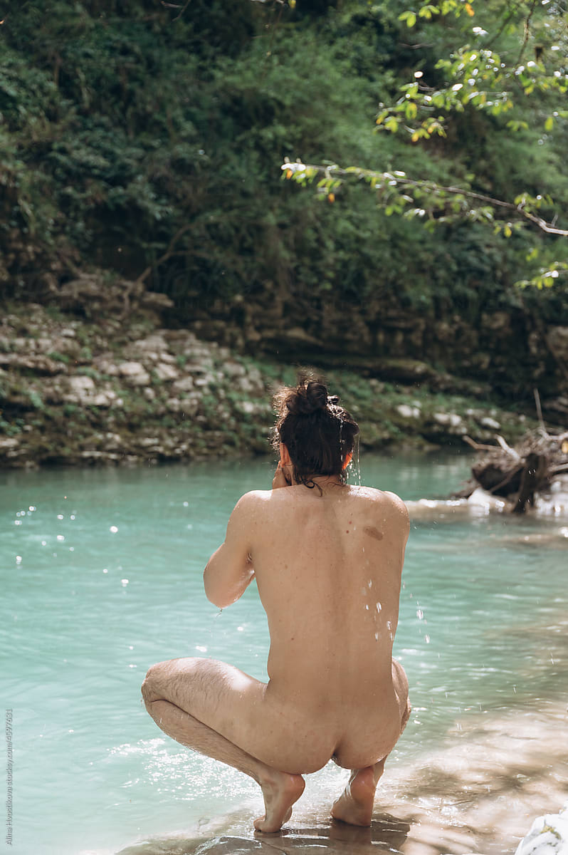 Naked Man Preparing To Swim In River\