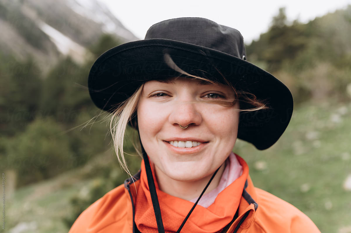 Female traveler enjoying fresh air in mountains