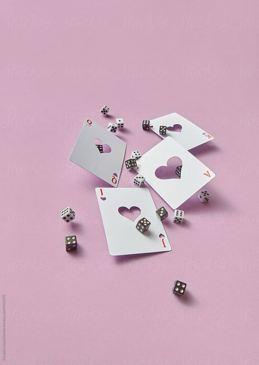 Crafted playing cards and black and white dice.
