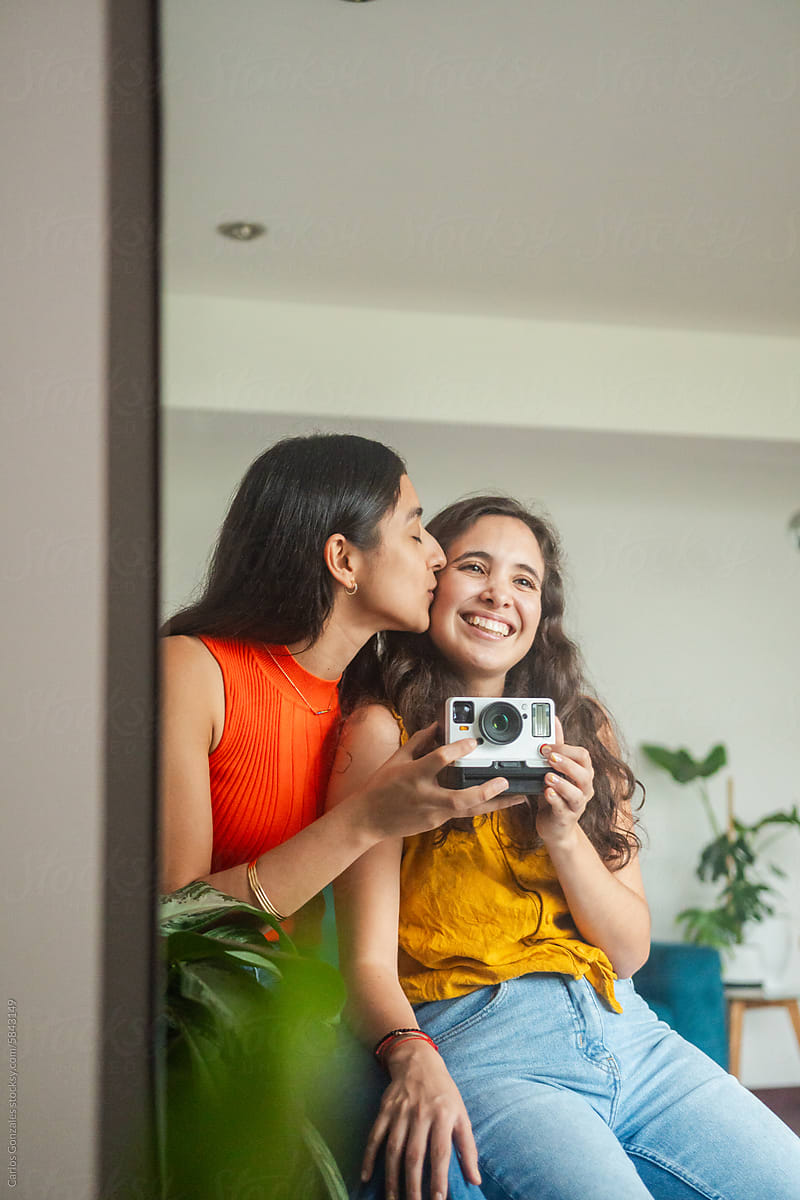 Young Lesbian Couple Taking a Selfie in the Mirror