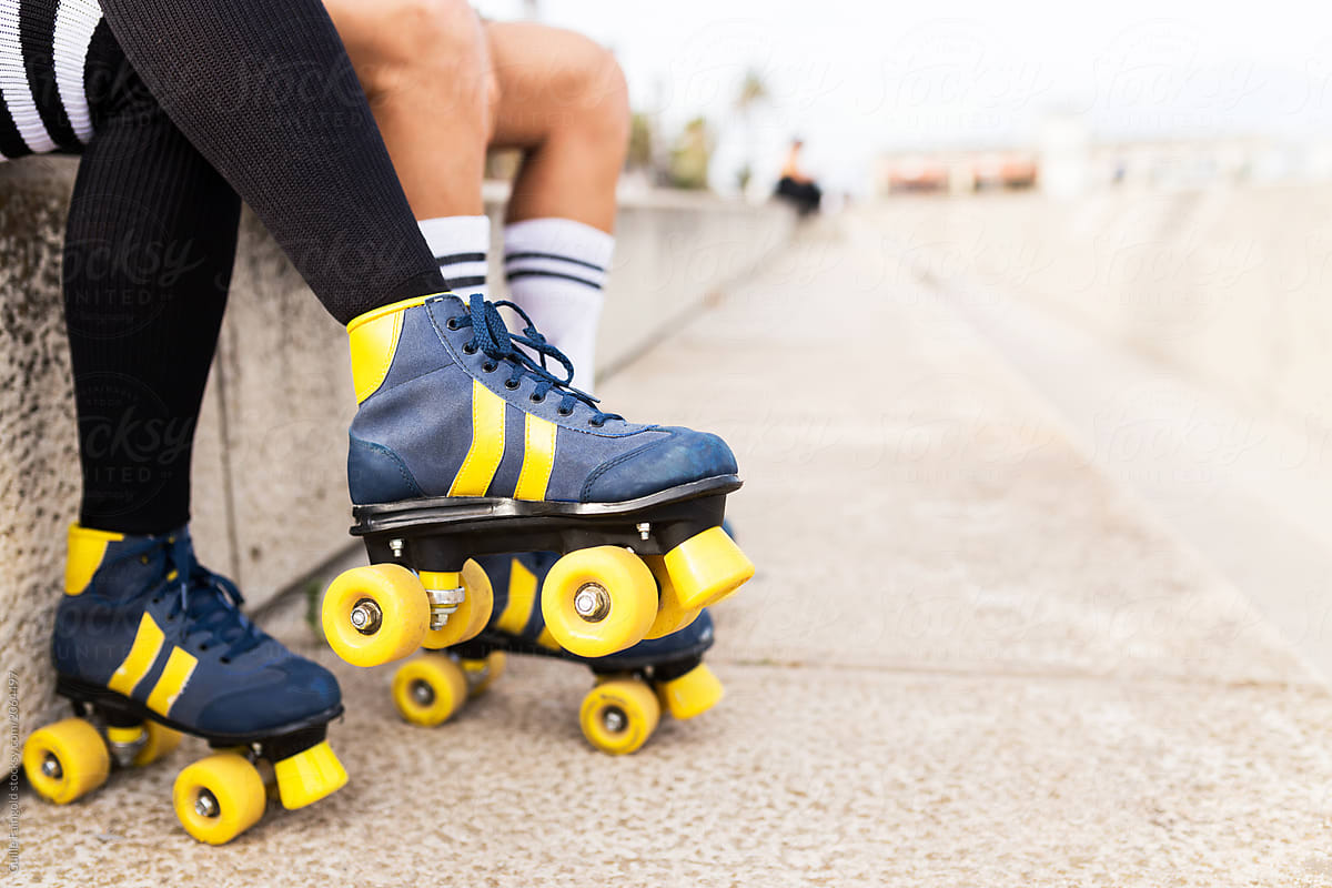 Couple\'s legs wearing roller skates