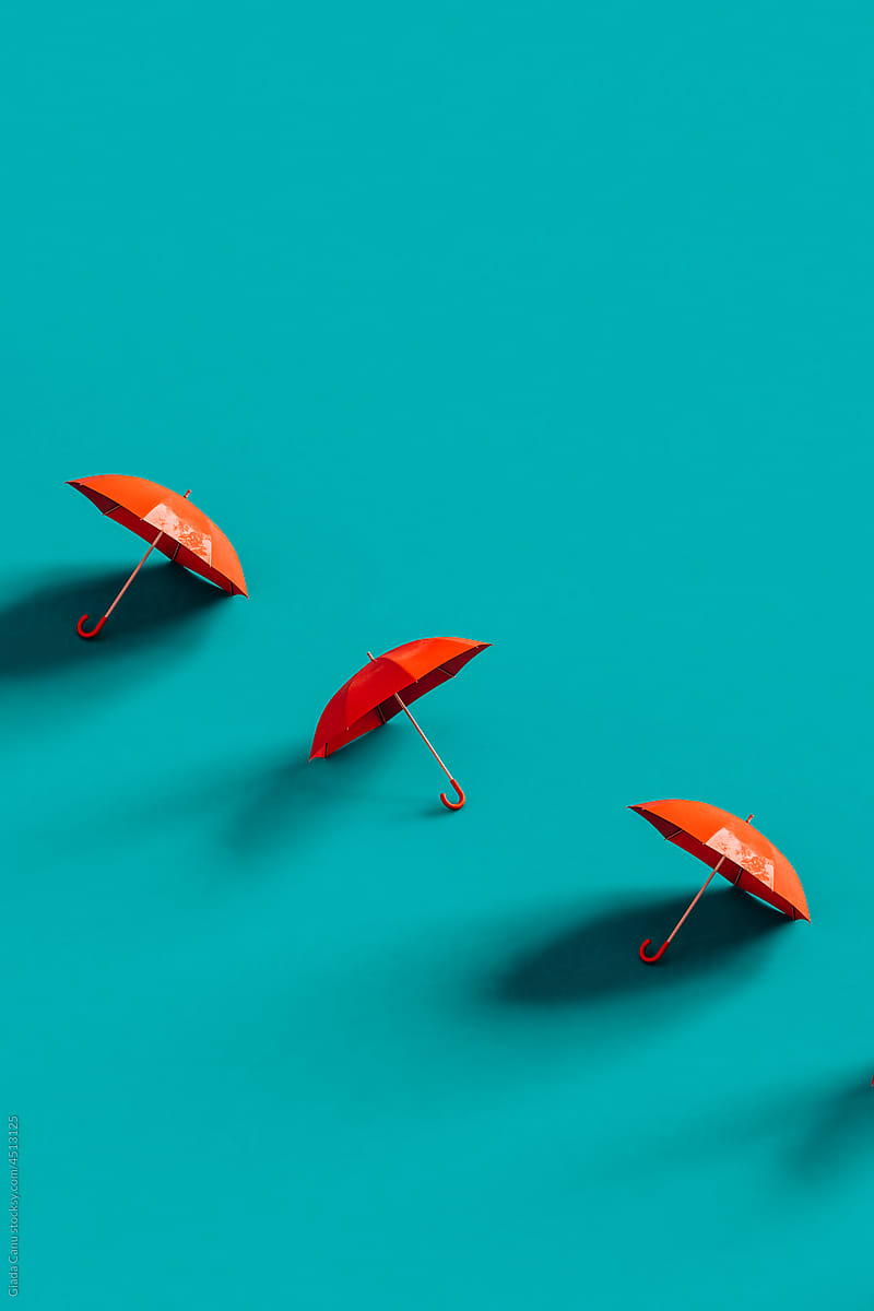 Red umbrellas placed in row